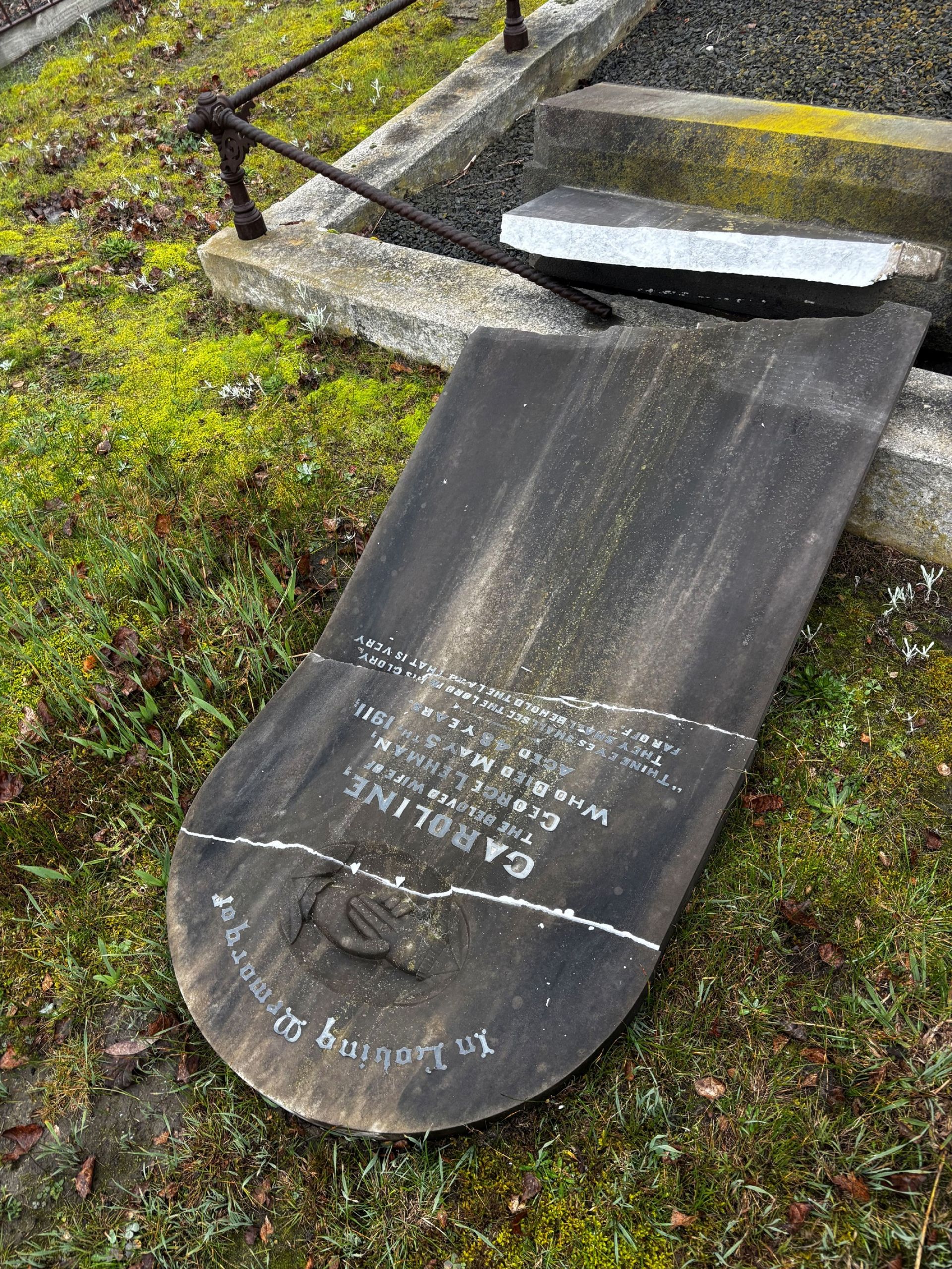 image shows a vandalised gravestone