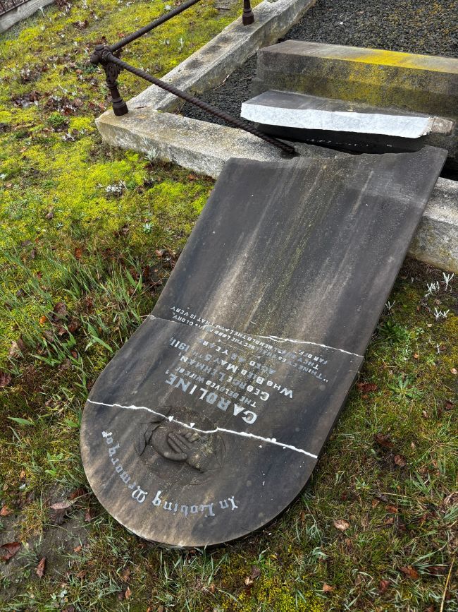 image shows a vandalised gravestone