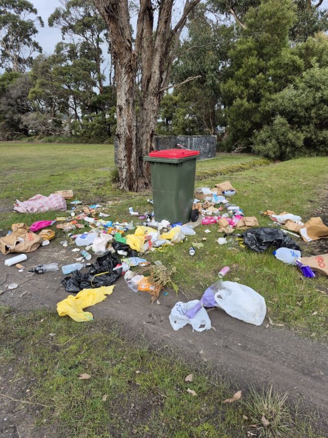 The image shows dumped rubbish