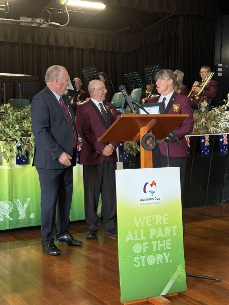 Shows a photo of the Latrobe Federal band accepting their award